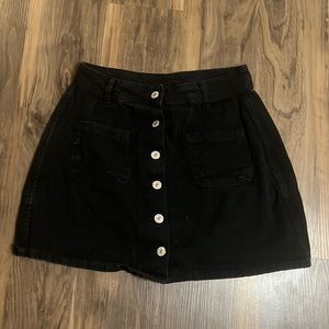 Black skirt with gold buttons